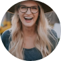 woman with hat smiling