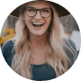 woman with hat smiling